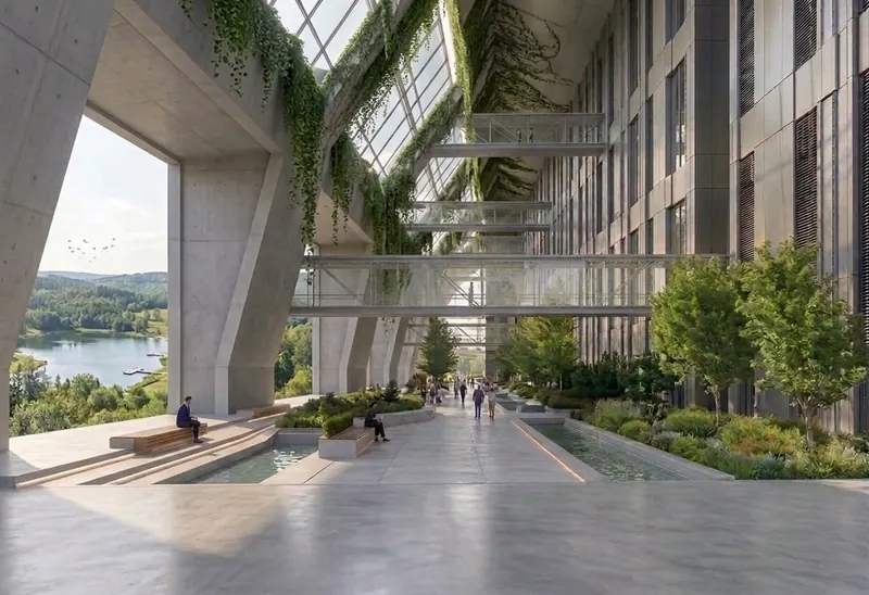 Data center renders: the solar-roofed hall in the reclaimed mine-lake landscape, and the planted interior atrium